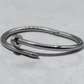 Nail-motif open cuff bracelet in silver