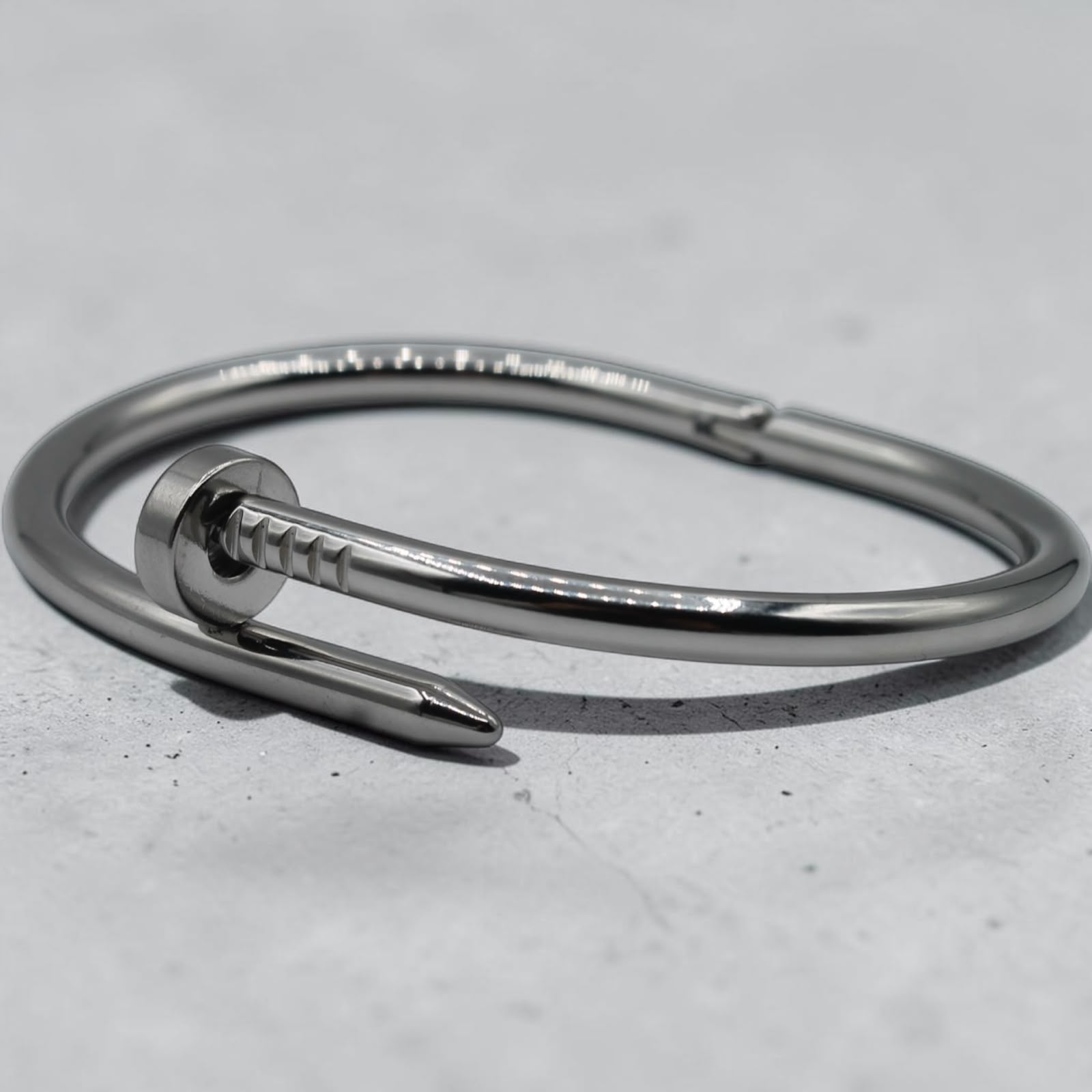 Nail-motif open cuff bracelet in silver