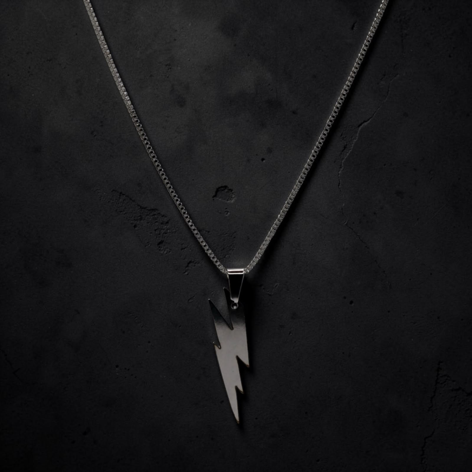 Lightning bolt pendant necklace, dramatic lighting